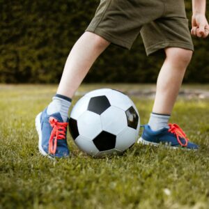 Andy Janson Coaching Sons in Sports Stock Photo