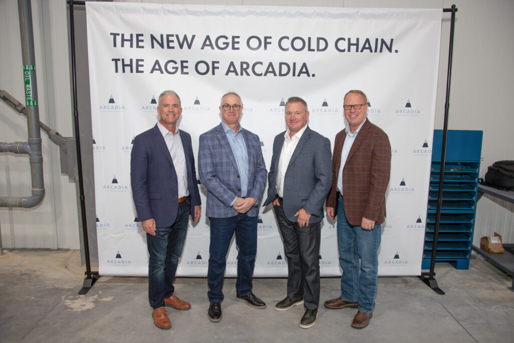 Arcadia leaders pose for photo in front of Arcadia Branded backdrop
