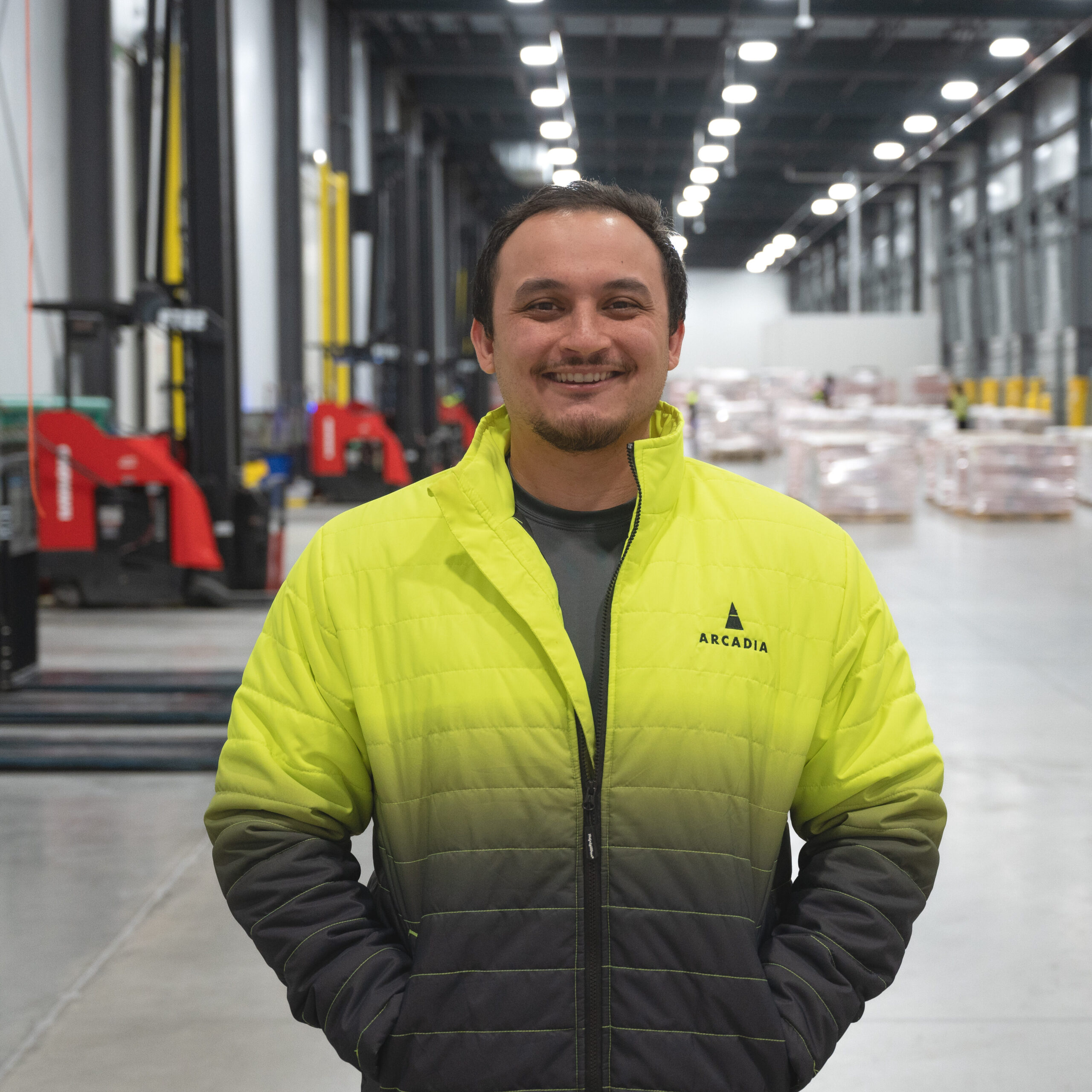 On-site HR resource posing for a professional headshot on the dock at Arcadia Cold’s Hazleton facility.